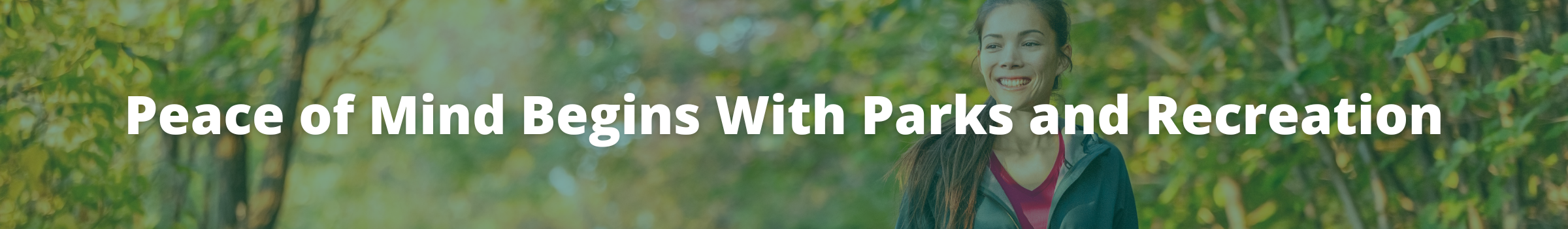 A person smiles while walking in a park. Text overlay reads: Peace of Mind Begins with Parks and Recreation