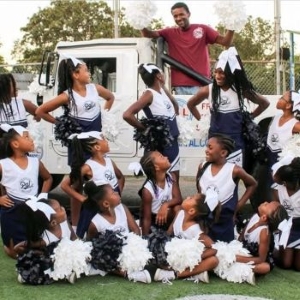 North Little Rock North Little Rock youth cheerleading program poses in front of truck